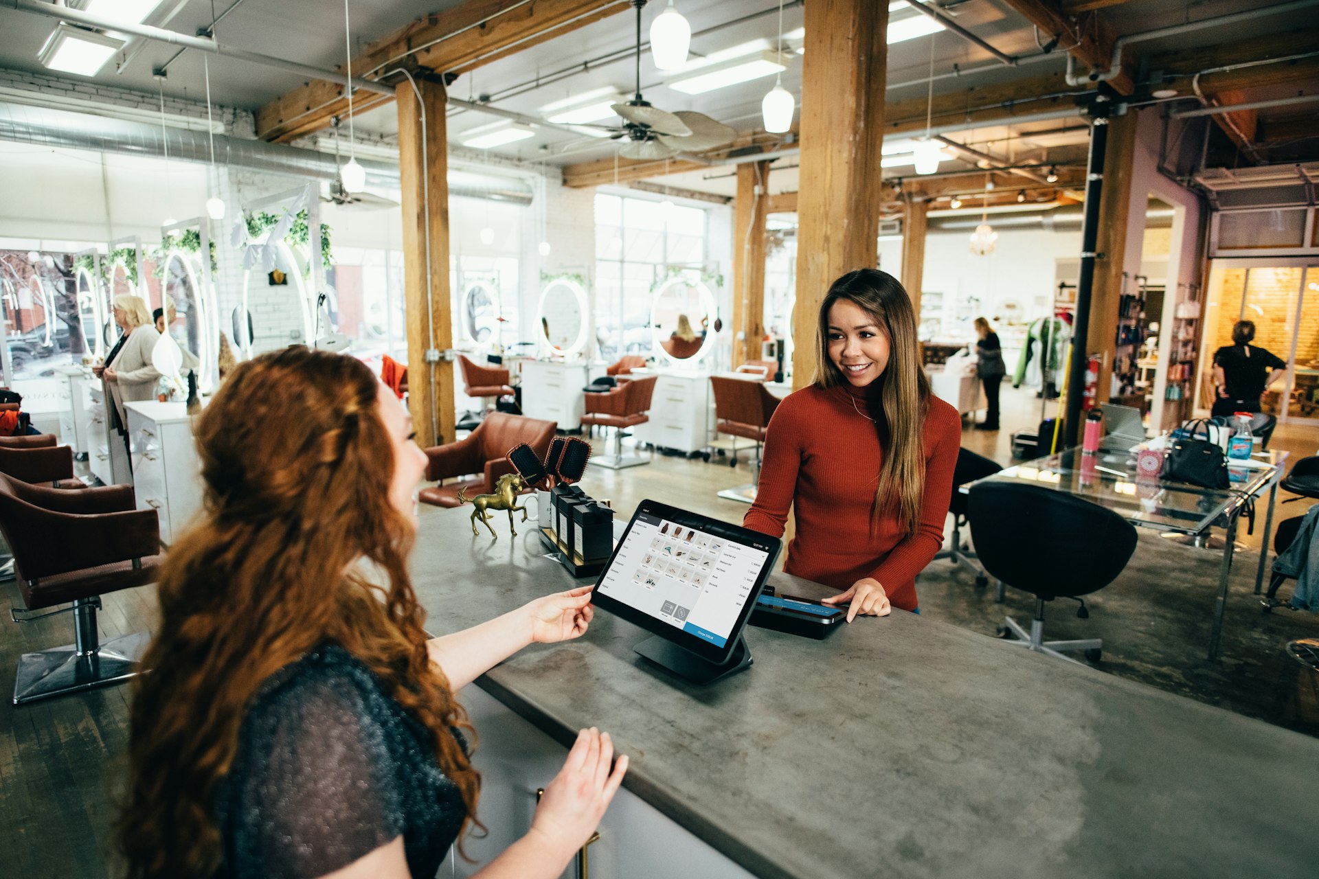 Customer paying at a shop counter